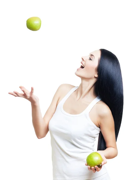 Happy woman throws up apple — Stock Photo, Image