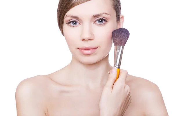 Natural woman with brush on cheek — Stock Photo, Image
