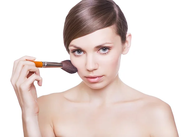 Natural woman with cosmetic brush on cheek — Stock Photo, Image