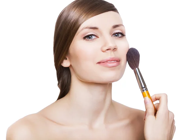 Natural woman with cosmetic brush on face — Stock Photo, Image