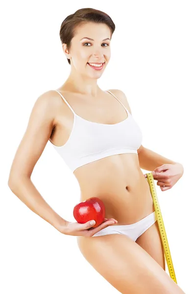 Friendly pretty girl in white with measure and red apple — Stock Photo, Image