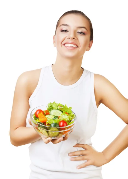 Bonita chica sonriente con ensalada en la mano — Foto de Stock