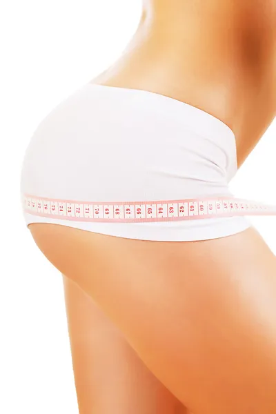 Woman hips and tapemeasure — Stock Photo, Image