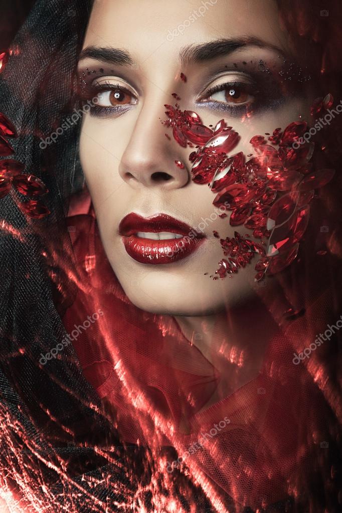 Portrait of passionate woman with gemstones Stock Photo by