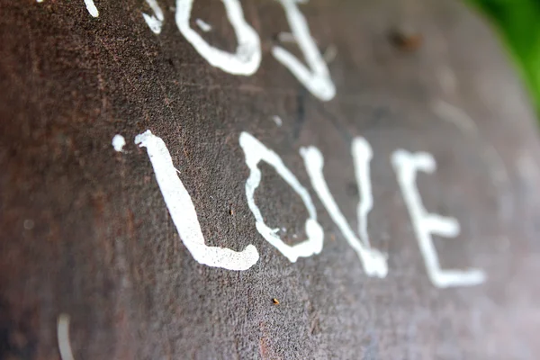 Älska text på bänk — Stockfoto