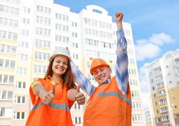 Female and male construction workers — Stock Photo, Image