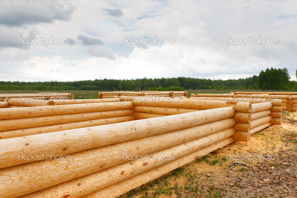 building a house from wooden logs