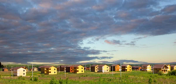 Wooden houses constructed out of town — Stock Photo, Image