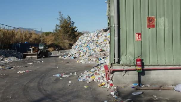 SANTA MARIA DE PALAUTORDERA, SPAIN - JANUARY 1, 2022:Waste falling on pile at recycling factory — Stockvideo