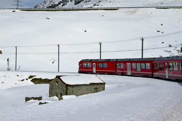 Red train and snow valley — Stock Photo, Image