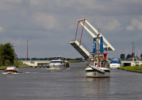 Dutch canal and raised drawbridge — Stock Photo, Image