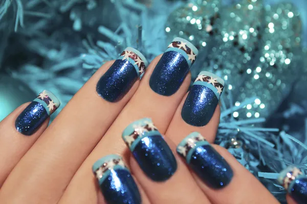 Beautiful winter blue manicure. — Stock Photo, Image
