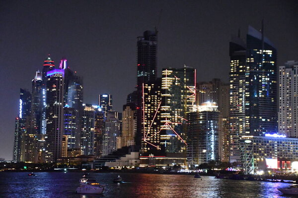 DUBAI, UAE - DEC 25: View of Dubai Marina at night, from Bluewaters Island, in Dubai, UAE, as seen on Dec 25, 2021.