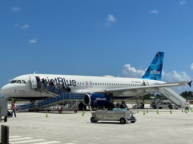GRAND CAYMAN, CAYMAN ISLANDS - FEB 20: JetBlue airplane at the Owen Roberts International Airport on Grand Cayman in the Cayman Islands, as seen on Feb 20, 2022.