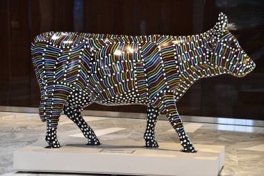 NEW YORK, NY - SEP 18: CowParade Sculptures at The Shops and Restaurants at Hudson Yards in Manhattan, New York City, as seen on Sep 18, 2021.