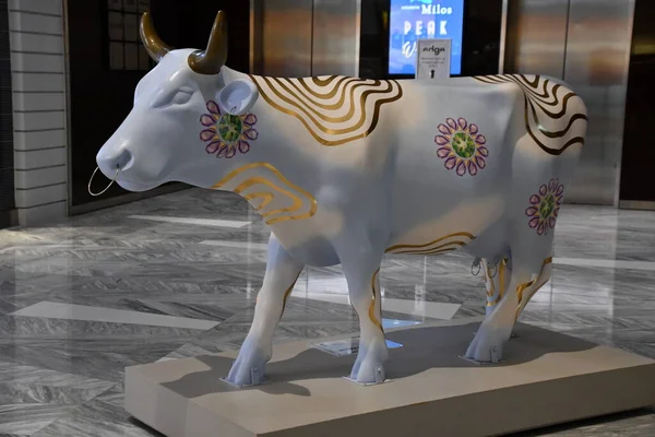 NEW YORK, NY - SEP 18: CowParade Sculptures at The Shops and Restaurants at Hudson Yards in Manhattan, New York City, as seen on Sep 18, 2021.