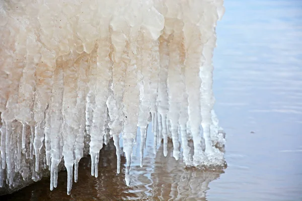 The frozen coast of the Gulf of Finland with a bizarre form of ice. Zelenogorsk, Russia, spring season, ice breaking period