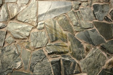 Farklı taşlardan ve betondan yapılmış doku. Resim arkaplan olarak kullanılabilir