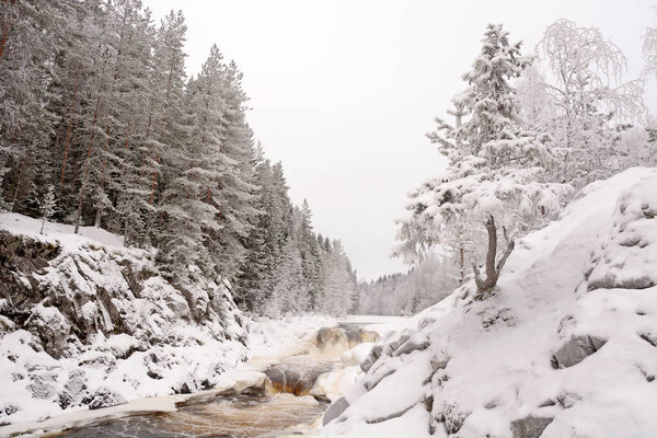 The pearl of Karelia Republic- Kivach waterfall at winter season