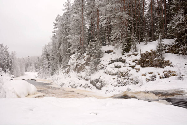 The pearl of Karelia Republic- Kivach waterfall at winter season