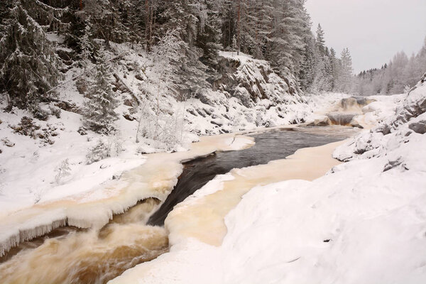 The pearl of Karelia Republic- Kivach waterfall at winter season