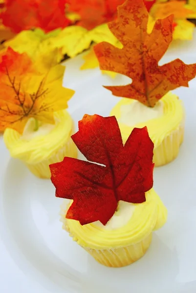 Lemon Cupcake with Maple Leaf Decoration — Stock Photo, Image