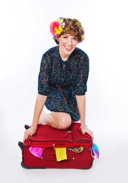 Young woman packing her suitcase — Stock Photo, Image