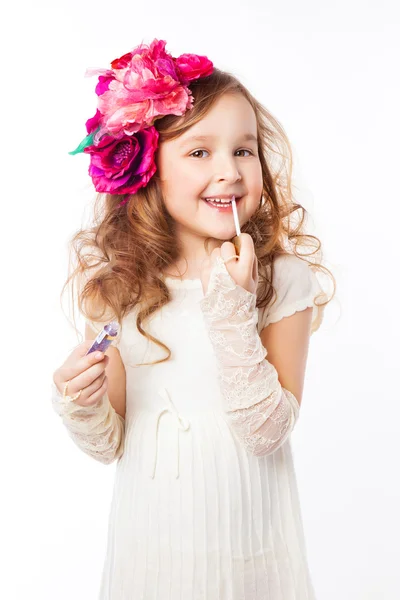 Little girl applying lipstick — Stock Photo, Image