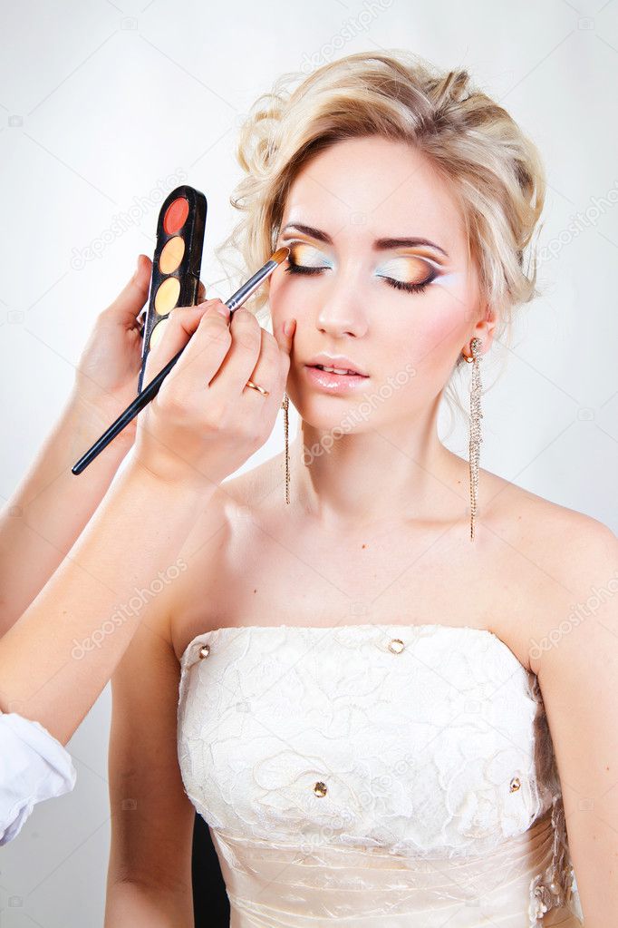 Applying wedding makeup