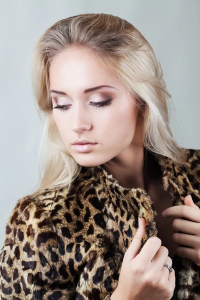 Beautiful fashionable girl in fur coat Stock Image