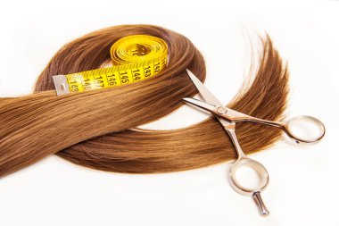hairdresser scissors on hair with measuring tape clipart