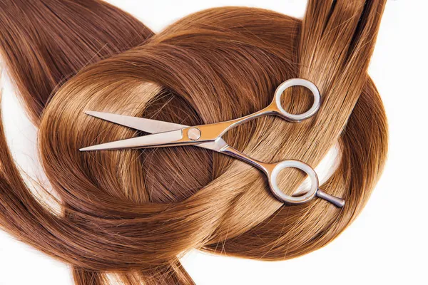Hairdresser scissors on the hair — Stock Photo, Image