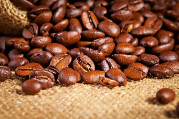 Sack bag full of roasted coffee beans — Stock Photo, Image