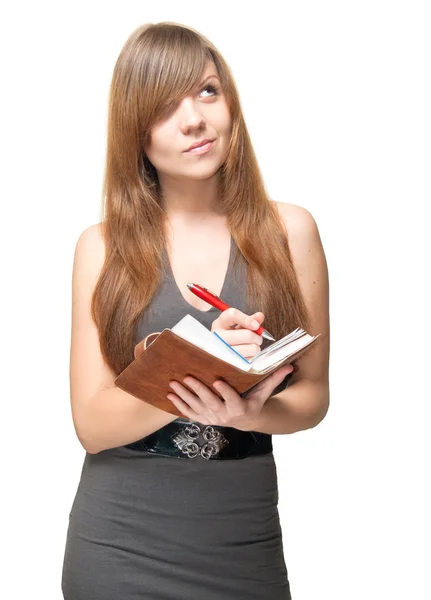 Ładny młoda kobieta z pióra i notatniku głęboko w myśli — Zdjęcie stockowe