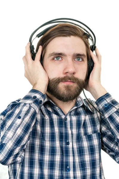 The man with a beard in earphones — Stock Photo, Image