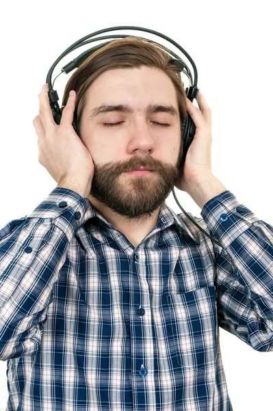 L'homme avec une barbe dans les écouteurs — Photo