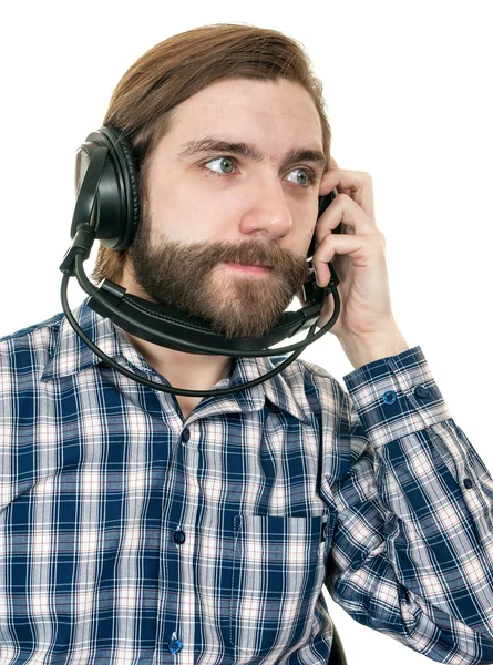 The man with a beard in earphones — Stock Photo, Image