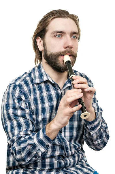 De jonge man spelen op een recorder — Stockfoto