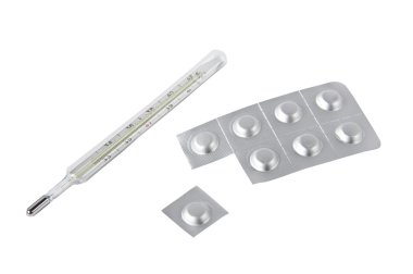 termometre ve üzerinde beyaz izole hapları