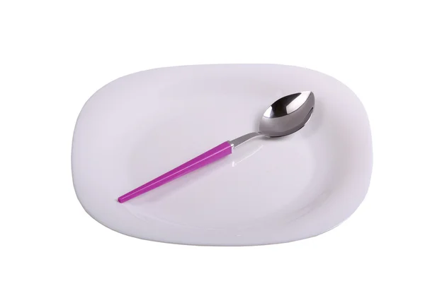 Spoon on a plate — Stock Photo, Image
