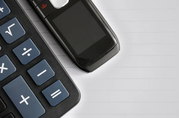 Mobile phone and a calculator — Stock Photo, Image