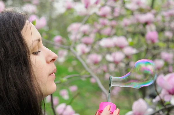 Girl blow bubbles — Stock Photo, Image