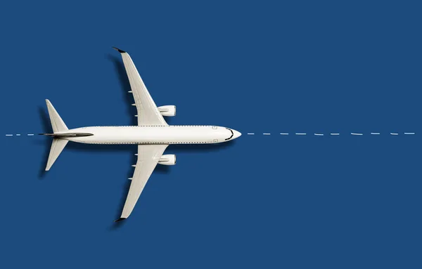 Top view of airplane on blue background.