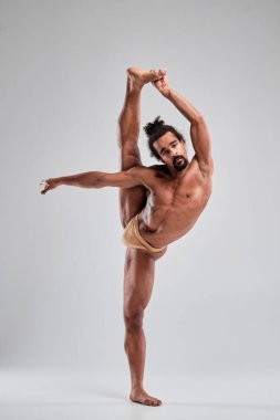 African American with a beautiful athletic body posing in the studio.