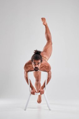 African American with a beautiful athletic body posing in the studio.