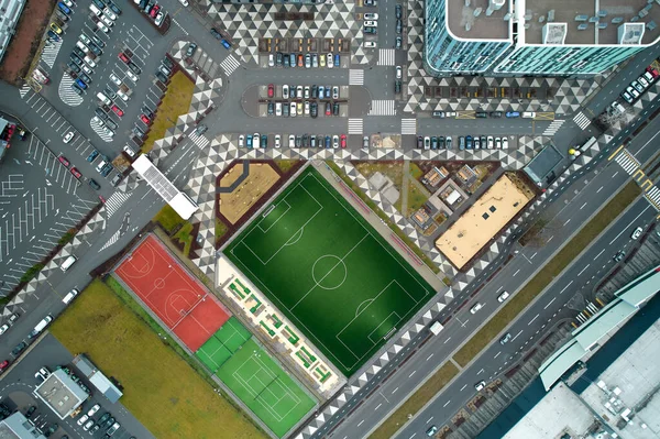 Football, tennis and basketball field in a modern residential area. Aerial photography.