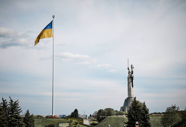 The main flag and The Motherland Monument is a monumental statue in Kyiv, Ukraine.