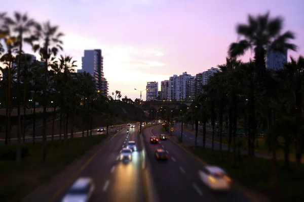 Cars on the road in the night city. Lima, Peru.