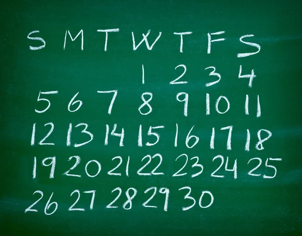 Kalender planner op een schoolbord — Stockfoto