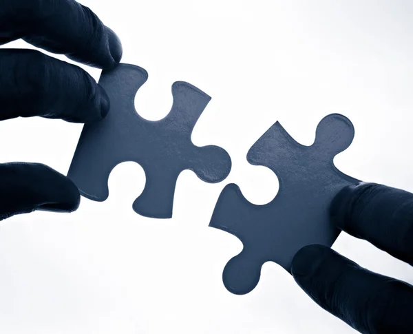 Puzzle game solution teamwork — Stock Photo, Image